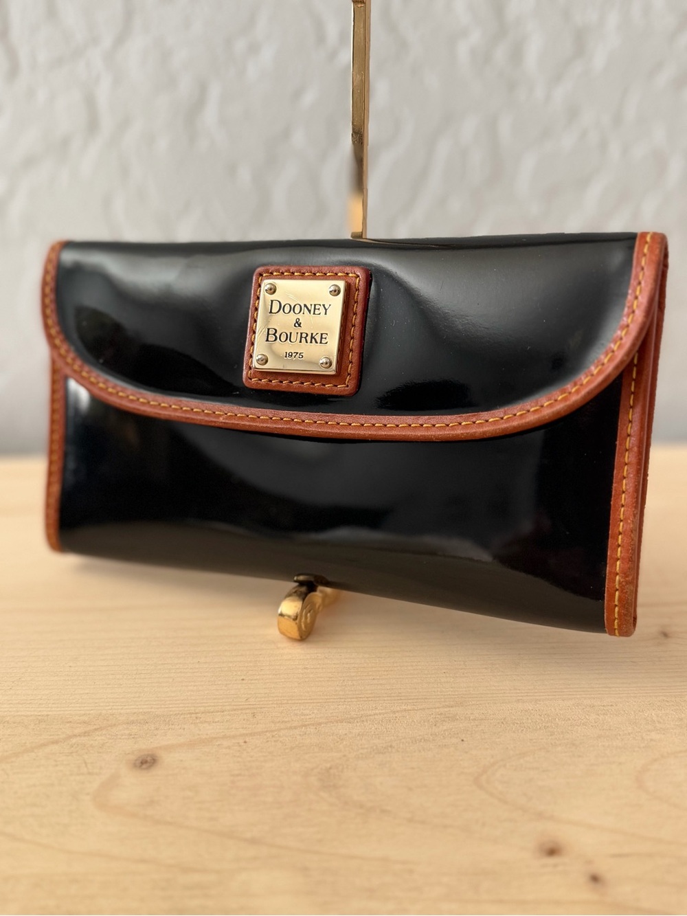 Dooney & Bourke Black Patent Leather Clutch with Brown Trim
